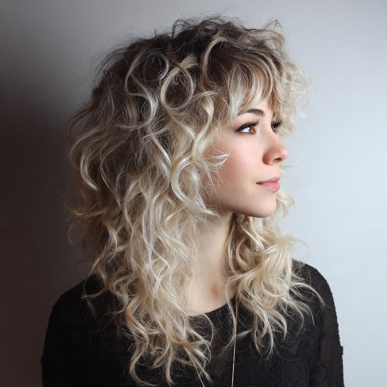 curly wolf cut with balayage hairstyle