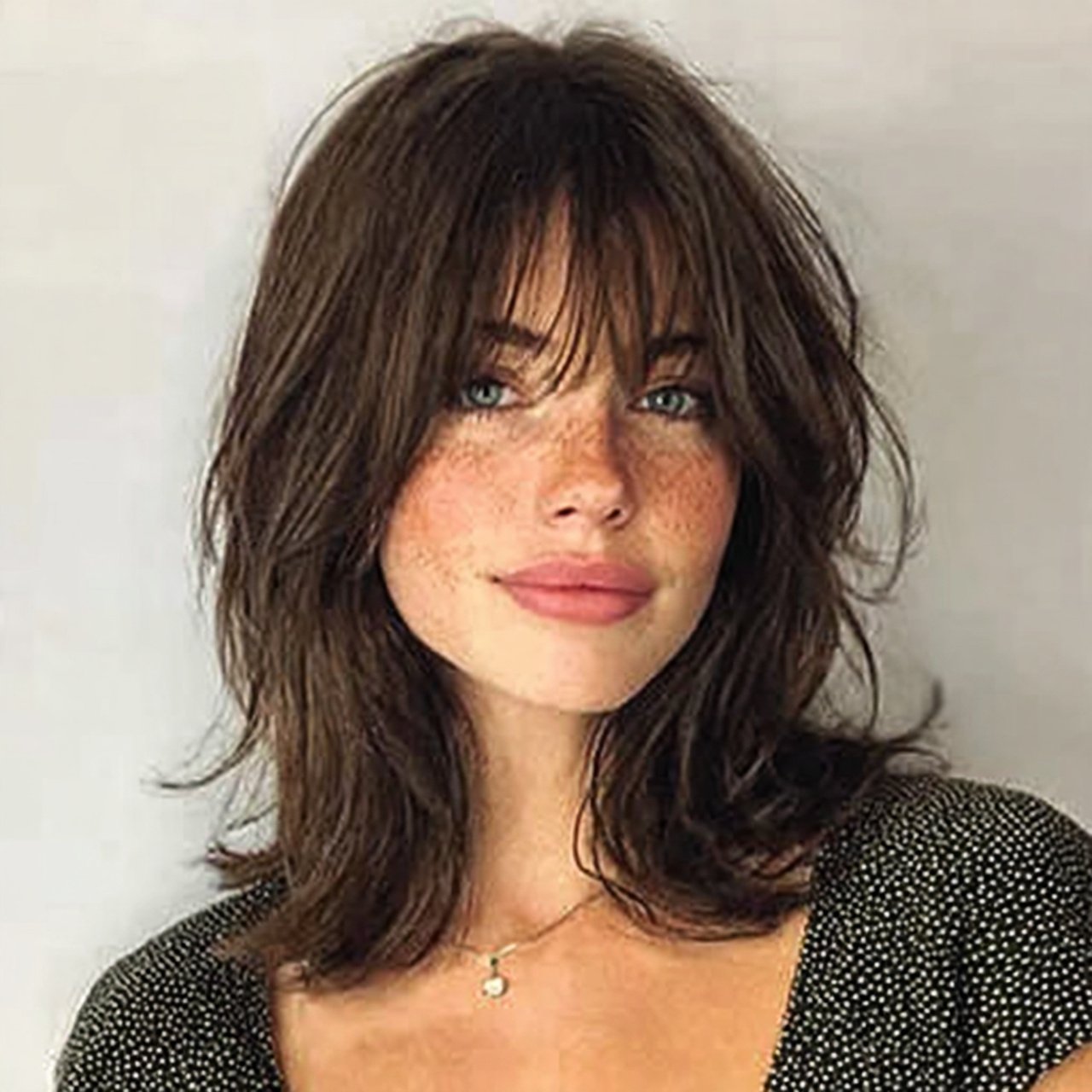 shoulder length curtain bangs hairstyle