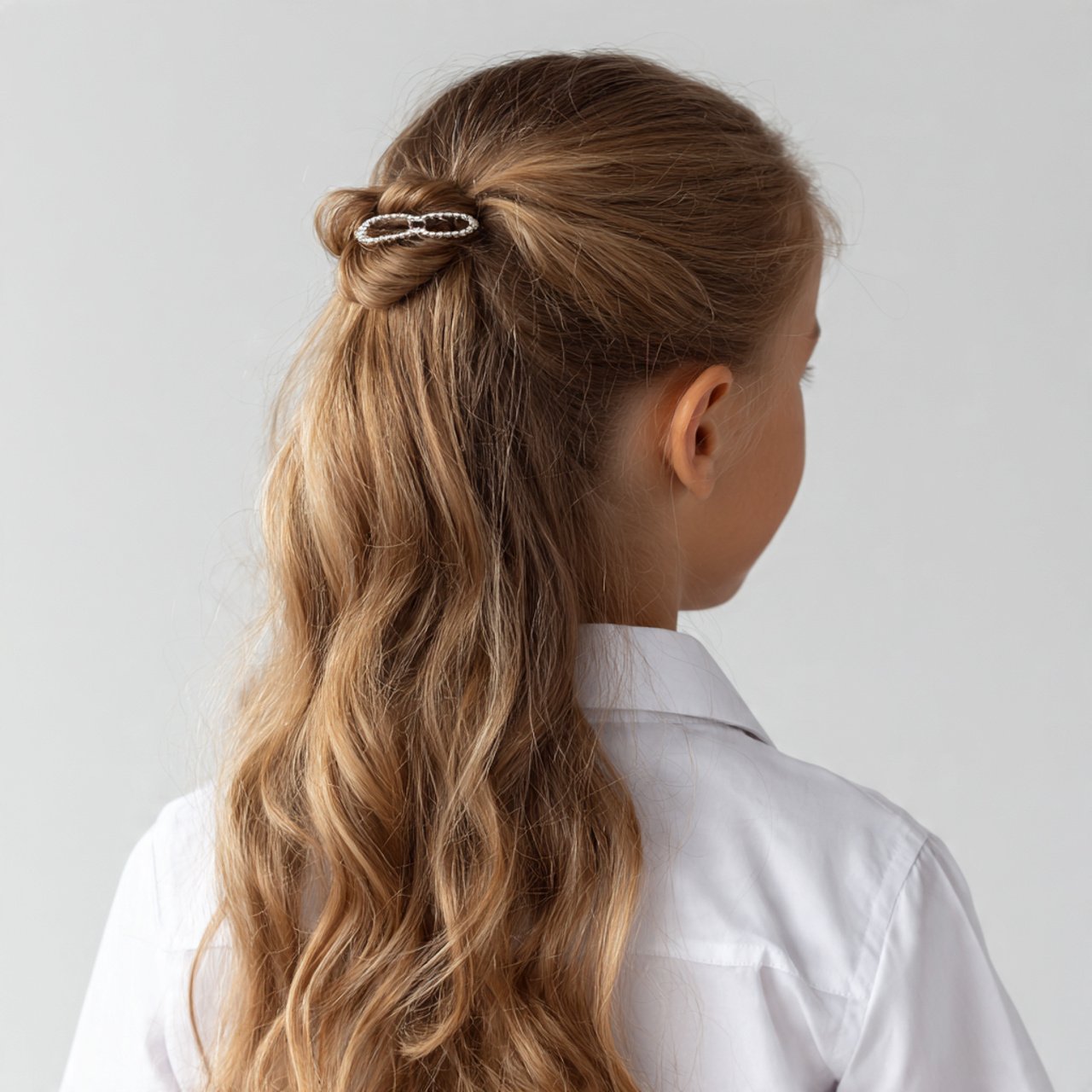 single photo of a half up clip hairstyle for schoo