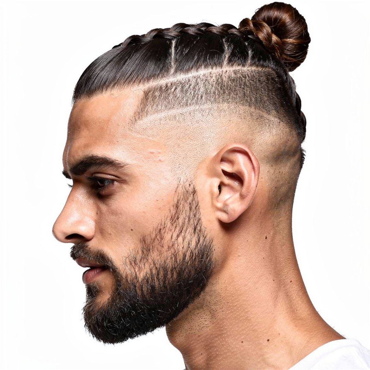 a stylish man with a braided man bun hairstyle clo 1