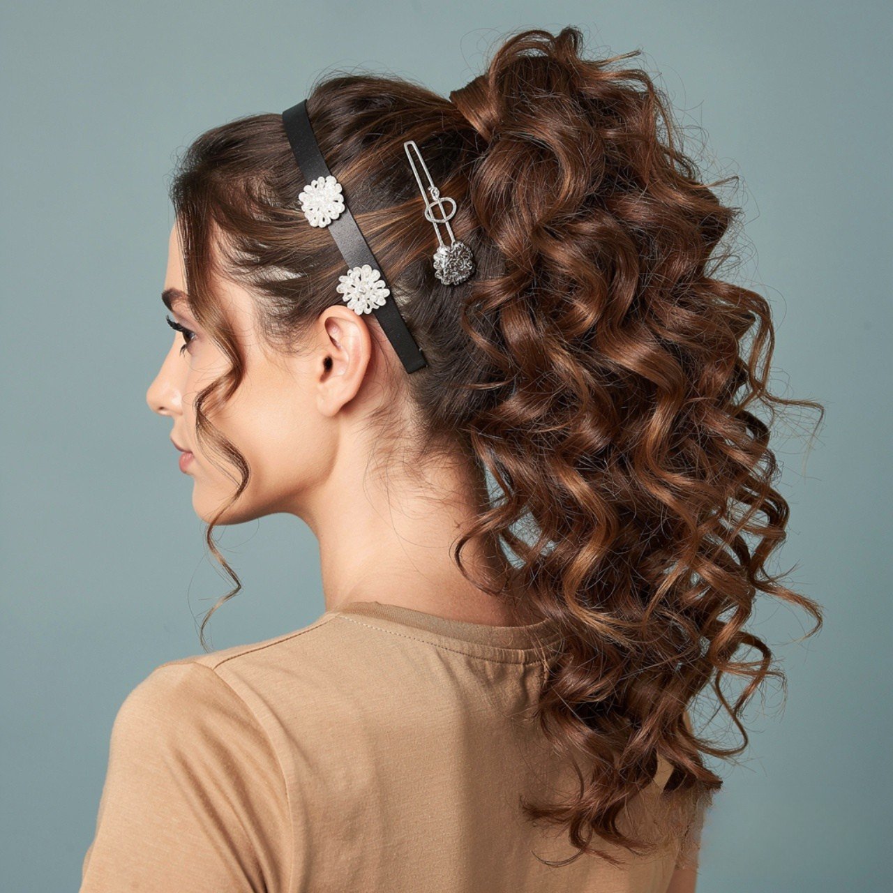 curly ponytail hairstyle with hair accessories squ