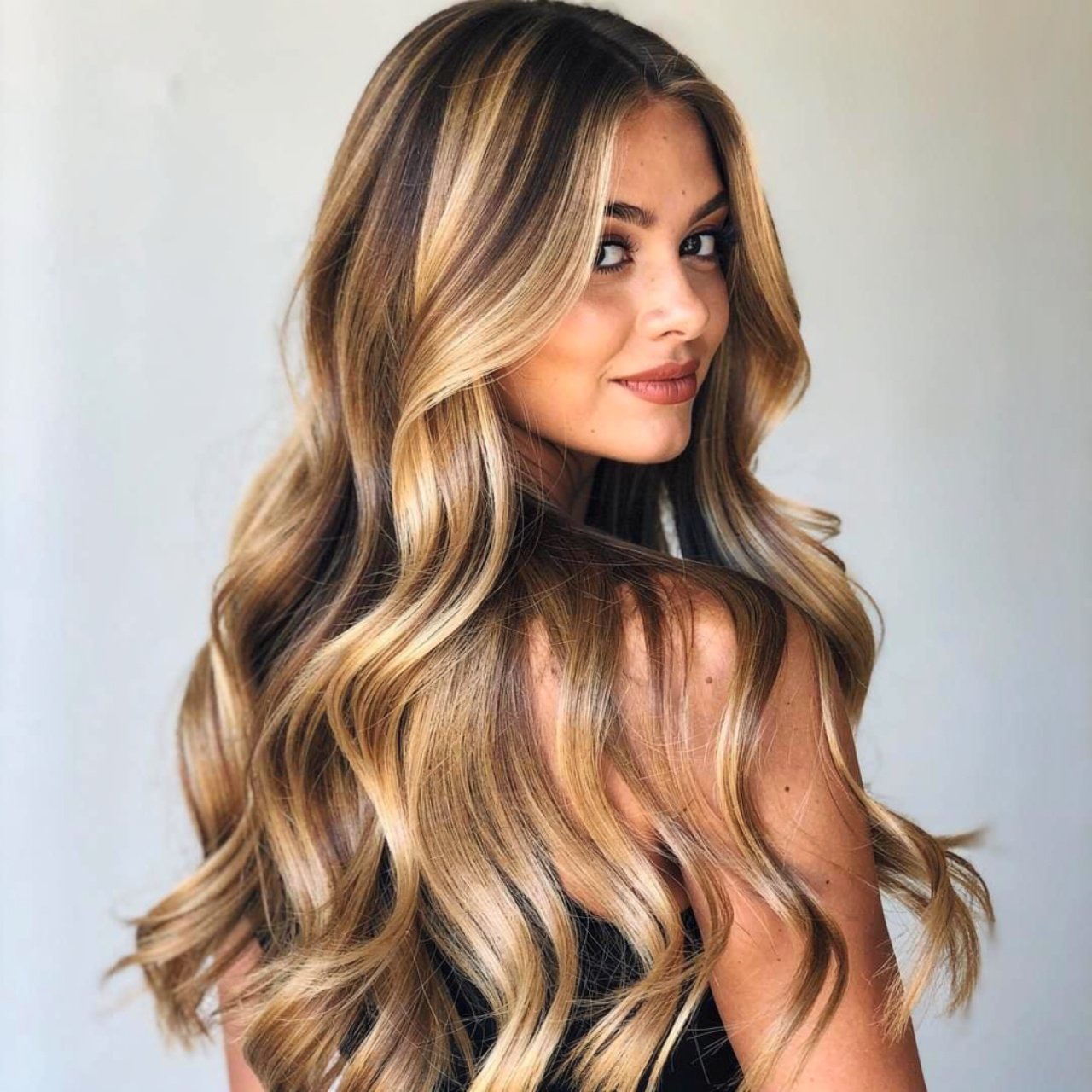 honey blonde balayage hair color on a woman single