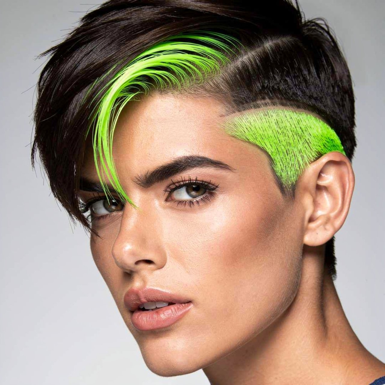 portrait of a person with neon green peekaboo high