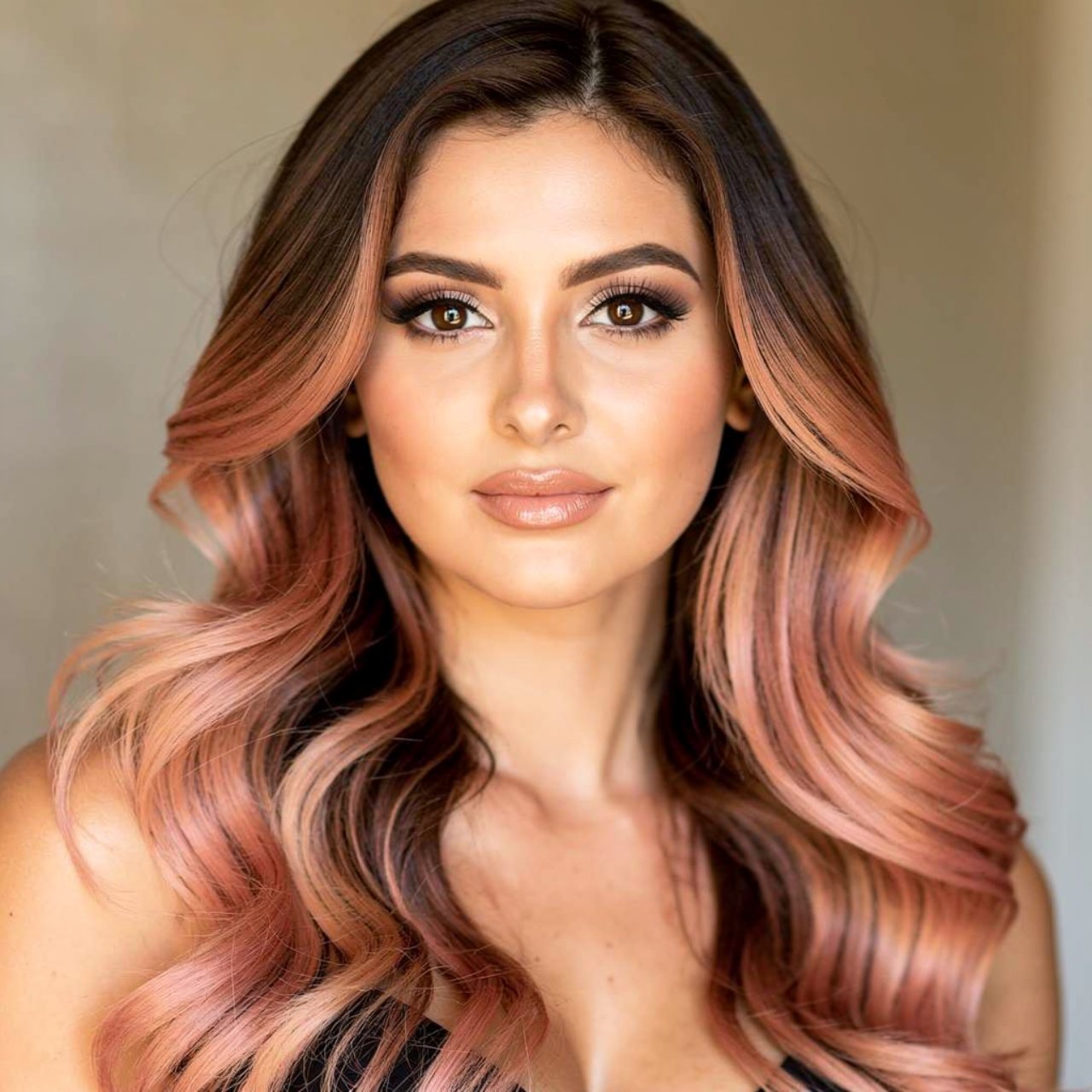 portrait of a woman with brunette to rose gold omb