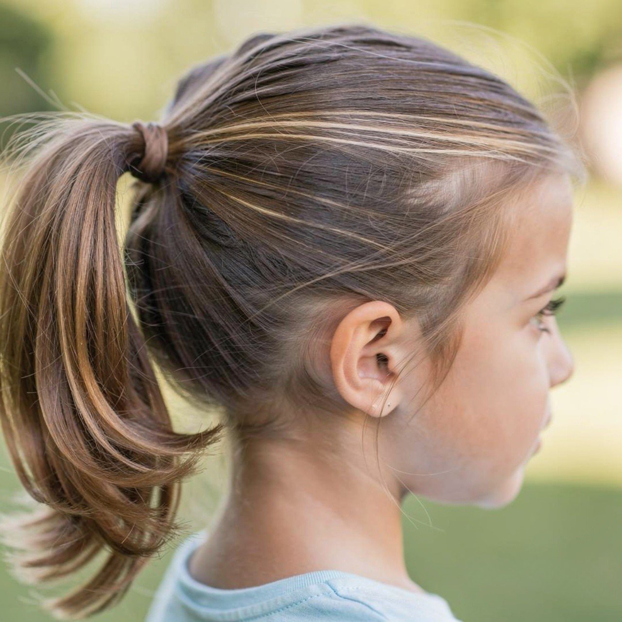 single photo of a child with a side ponytail hairs