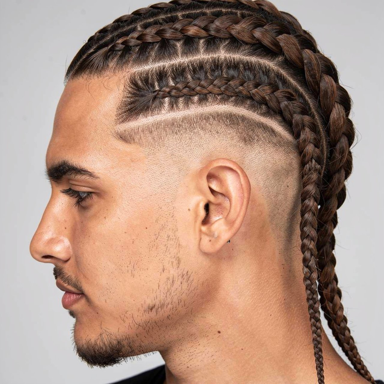 single photo of a man with dutch braids hairstyle