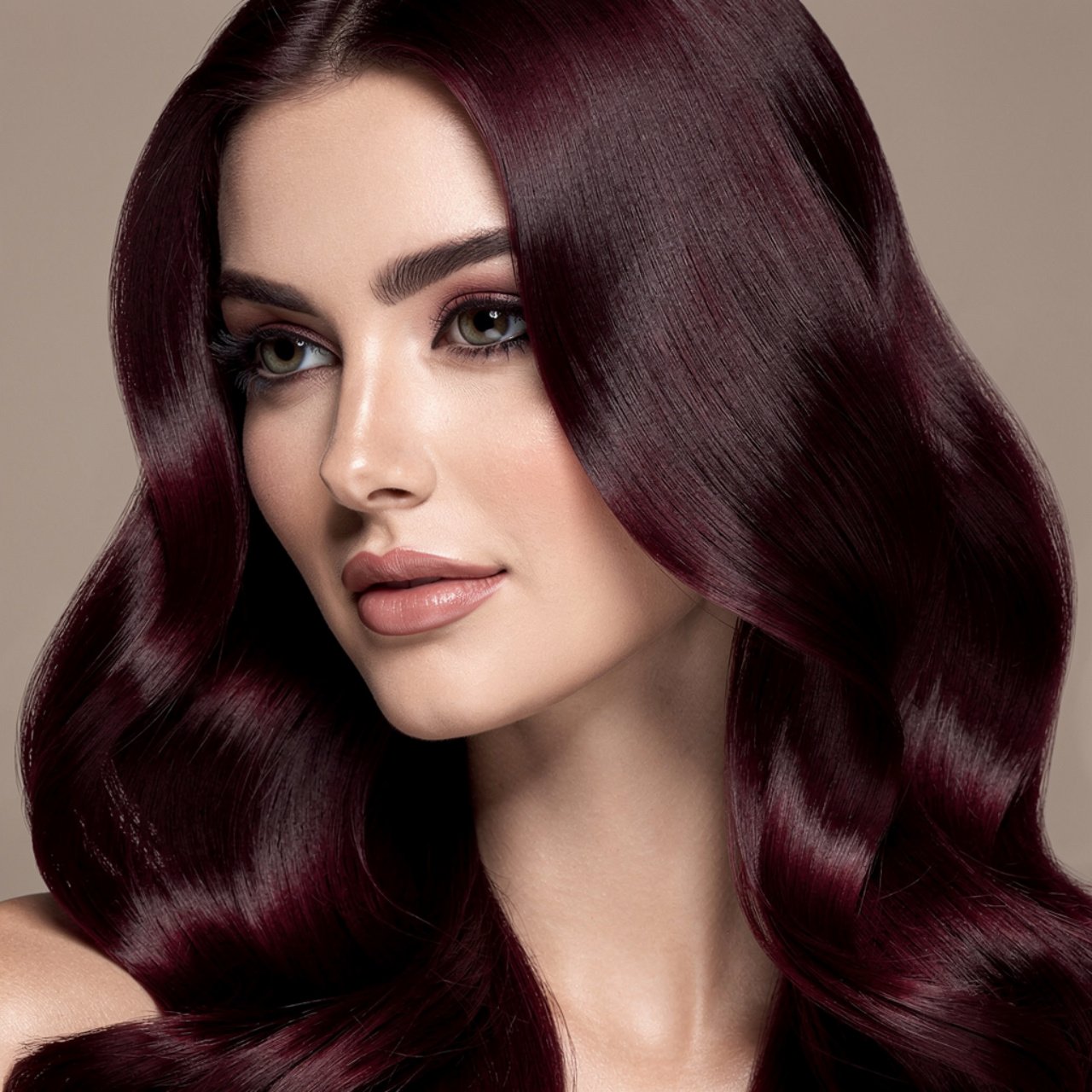 single portrait showcasing dark burgundy hair colo