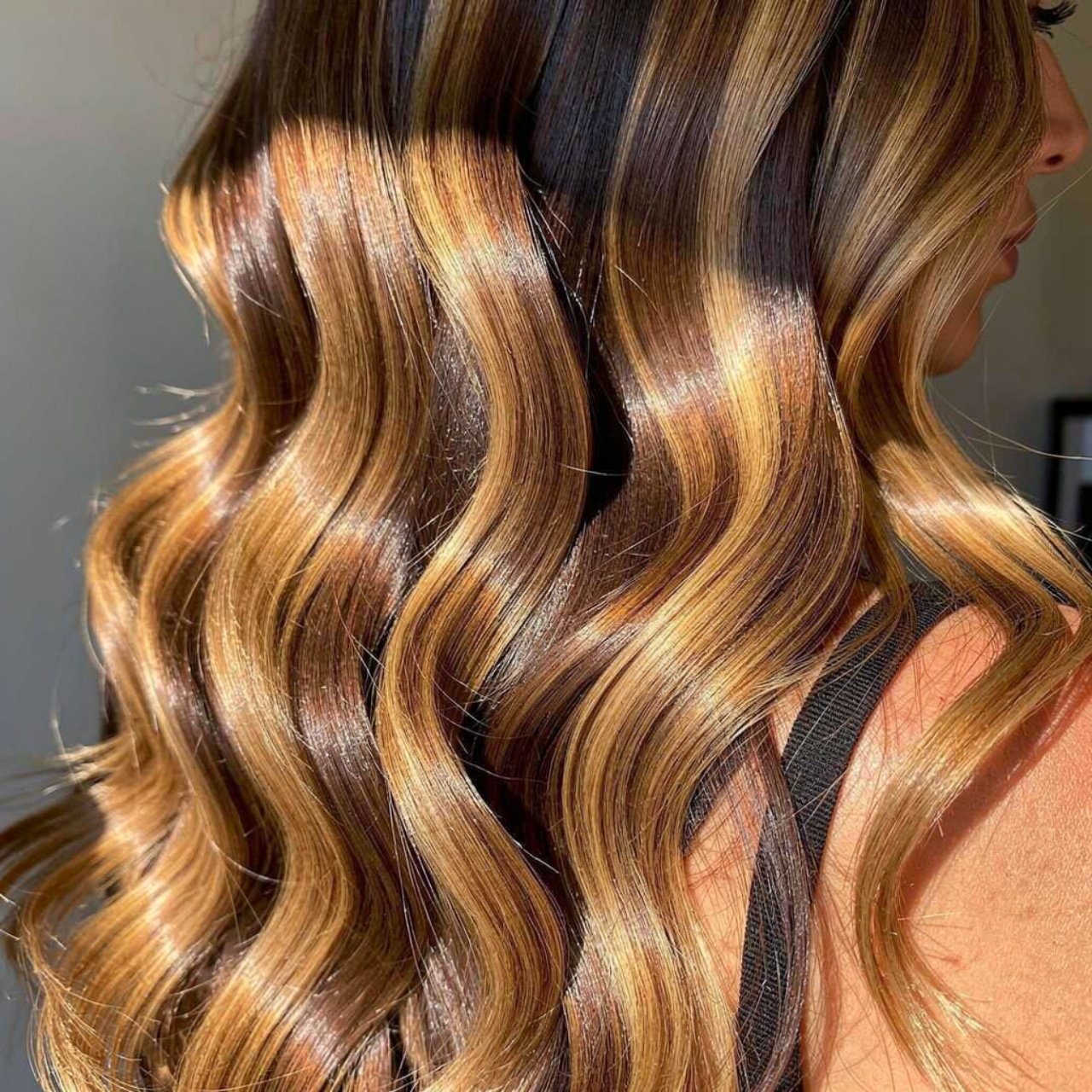 single square photo showcasing honey balayage hair