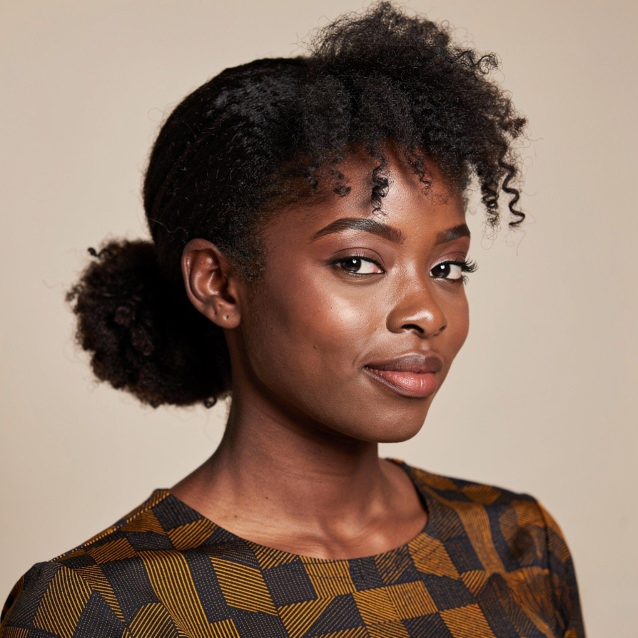 square portrait of a black woman with natural hair