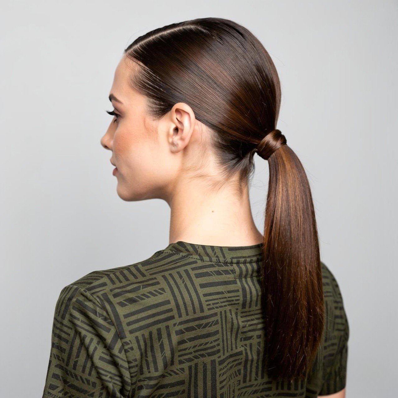 Fancy Ponytail Hairstyles: 15 Trendy Ideas that You’ll Love 9 square portrait of a woman with a sleek low fancy