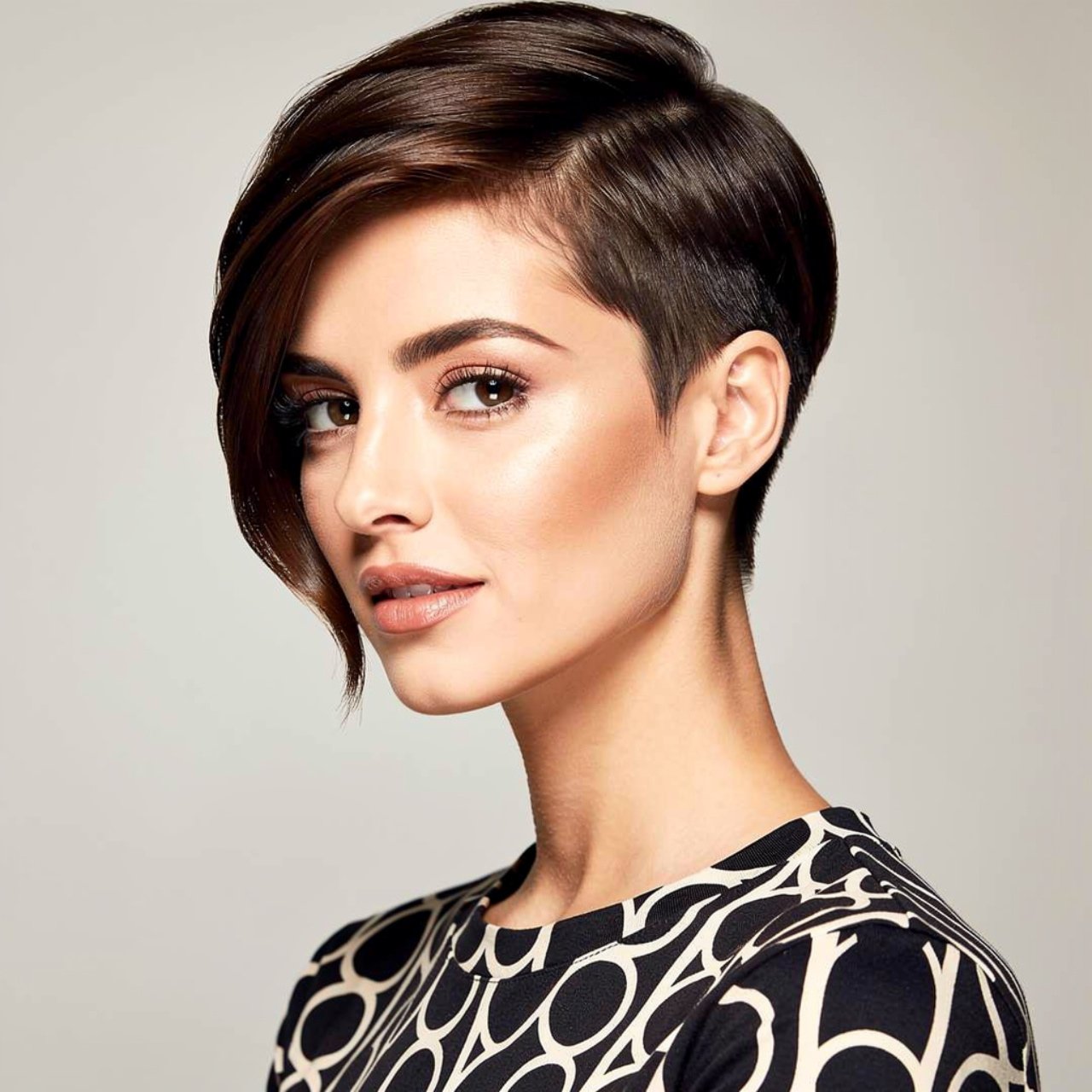 square portrait of a woman with a sleek side swept