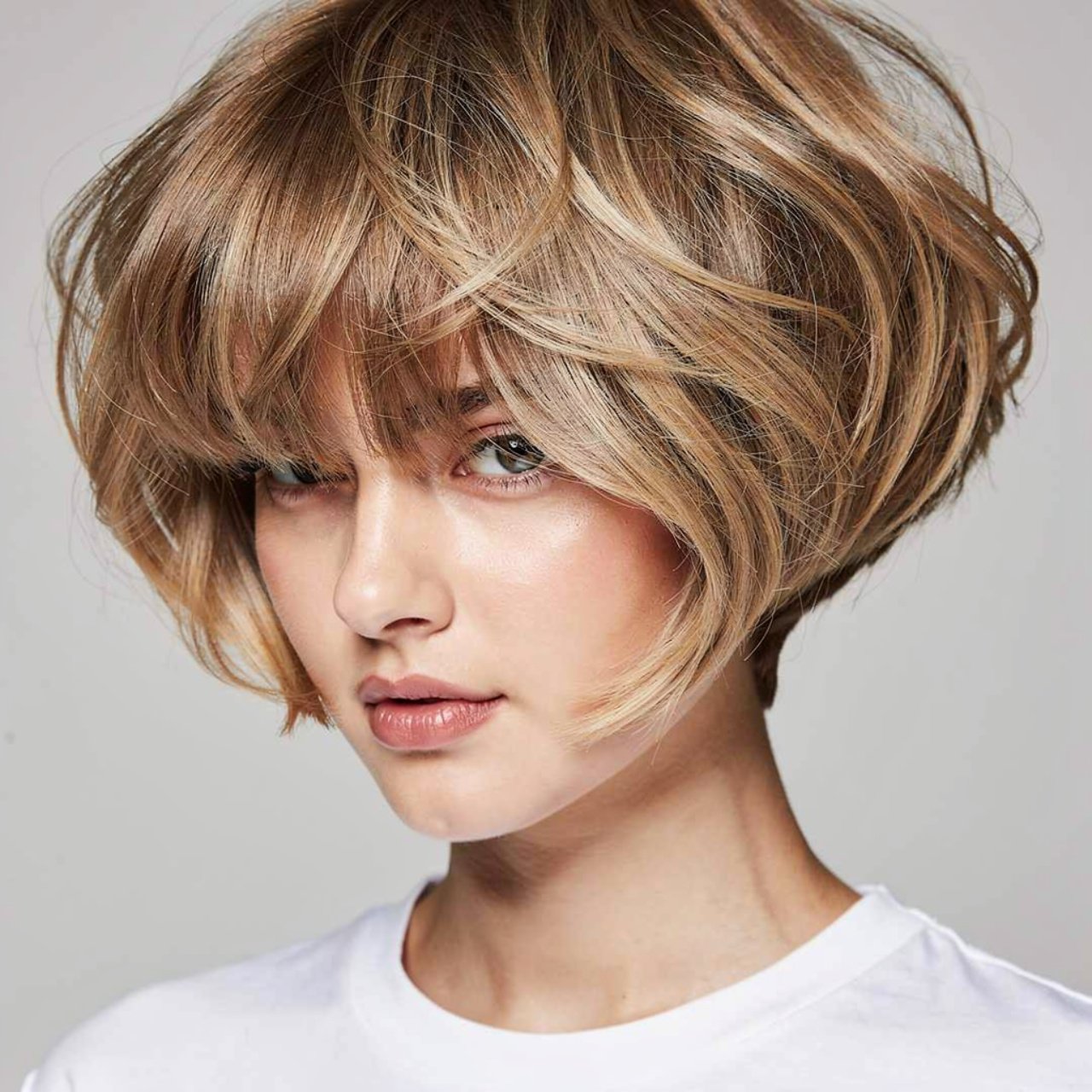 voluminous curtain bangs short hairstyle single po 1