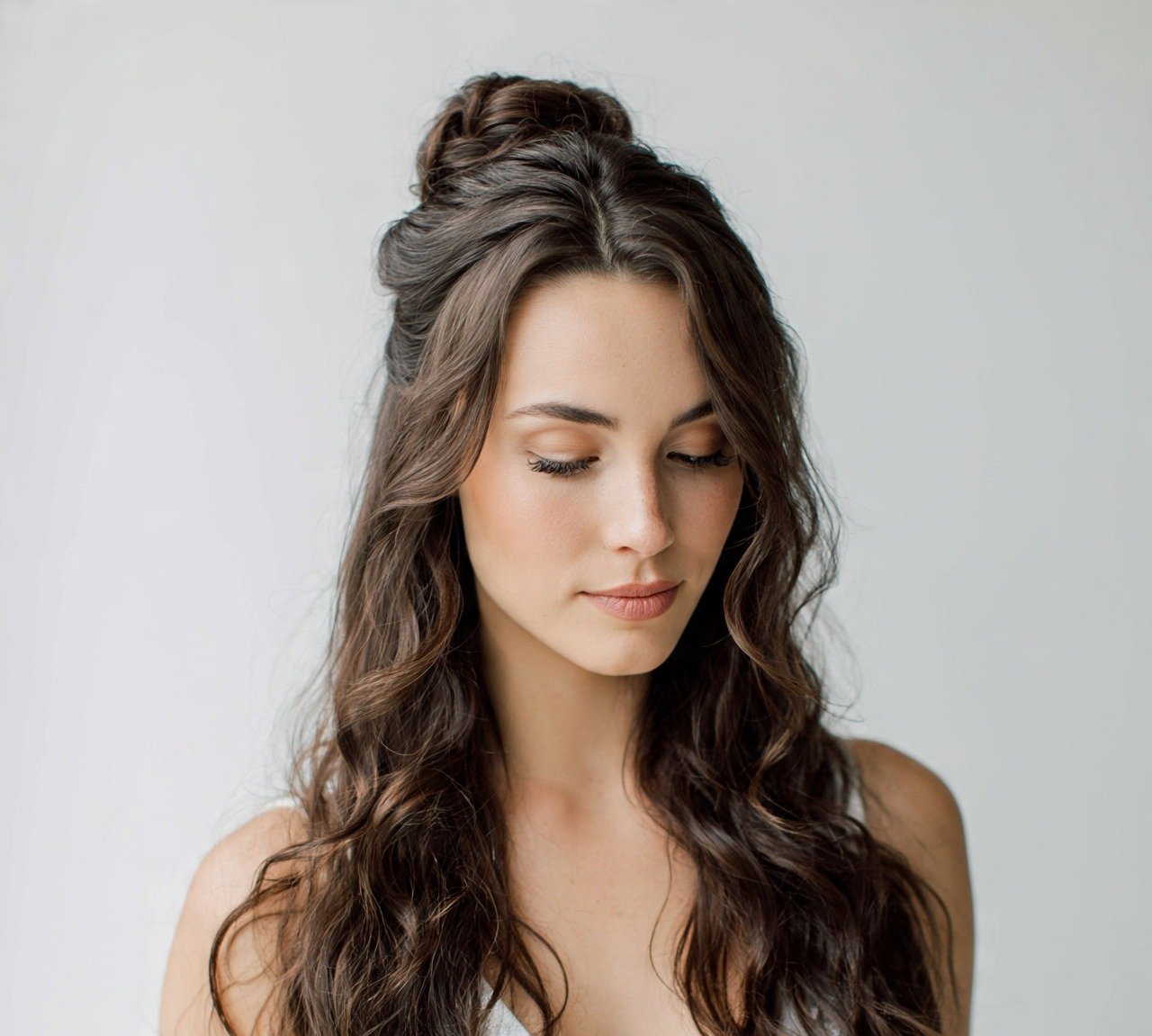 12. Half Up Bun with Cascading Waves Wedding Hairstyles