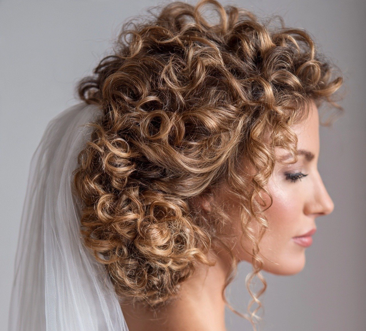 15. Veil Friendly Updo Curly Hair Wedding Hairstyles for the Big Day