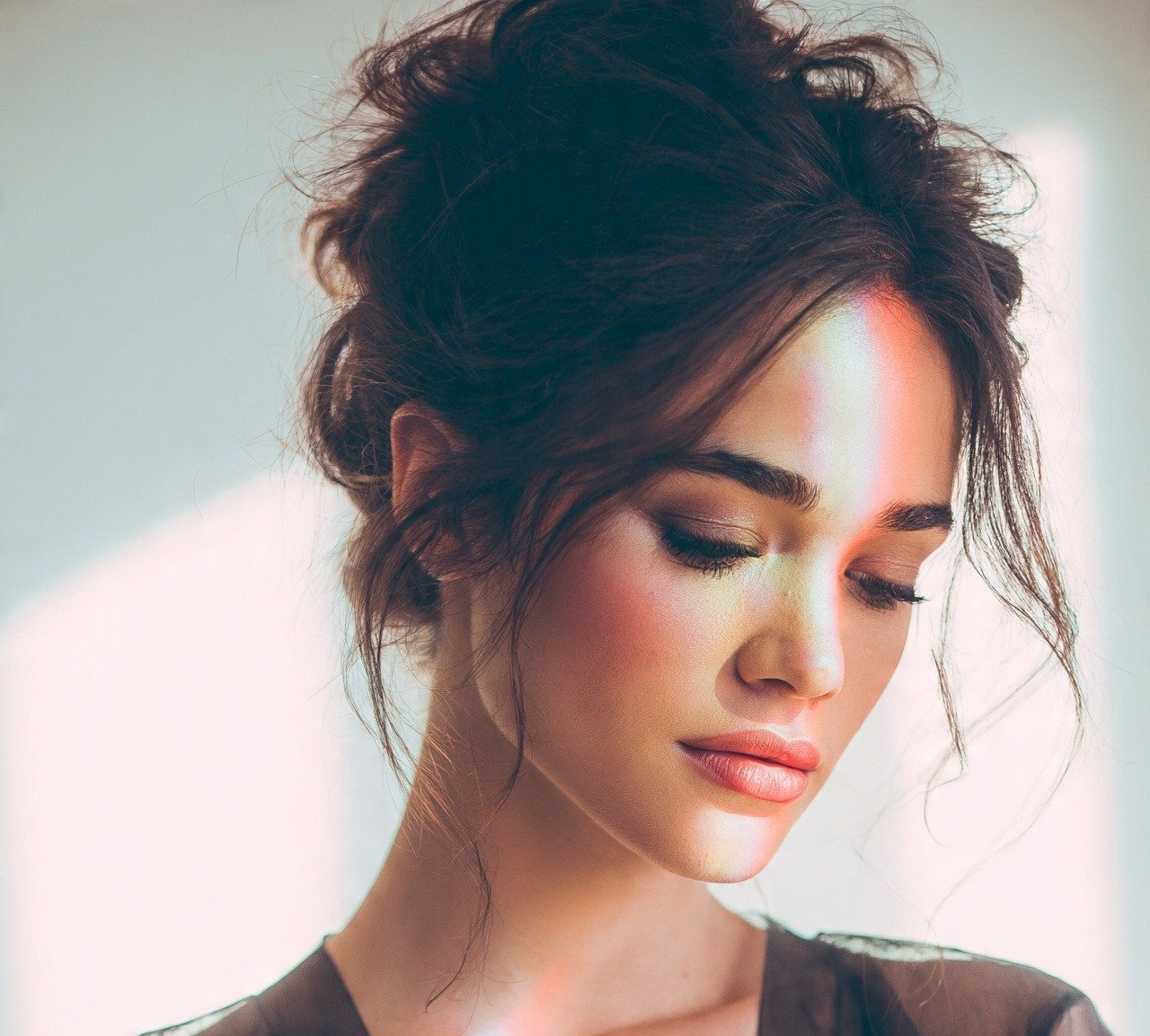 3. Messy Bun with Face Framing Layers Updo Hairstyles For Long Hair