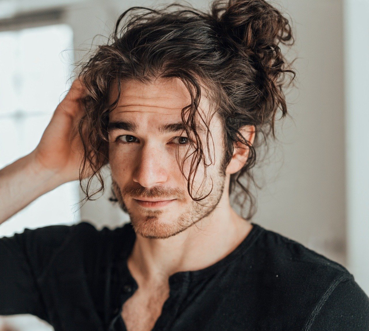 Wavy Hairstyles for Men: 15 Stylish Ideas to Try Now 10 9. Messy Wavy Bun Hairstyles For Men