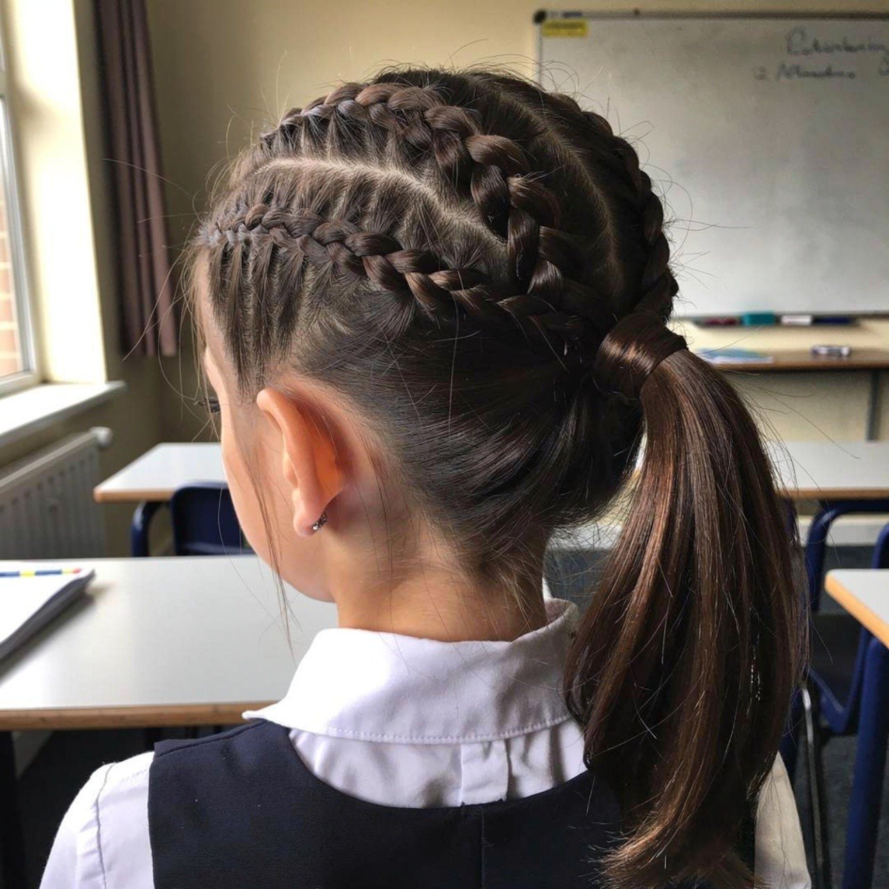 cornrow pigtail hairstyle for school single image