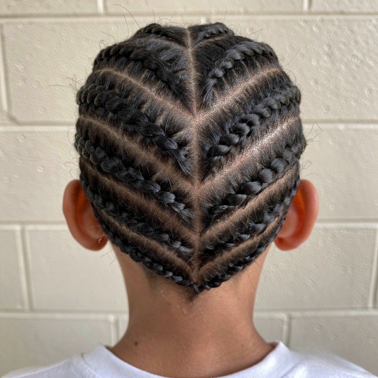 square photograph of a young student with a zigzag