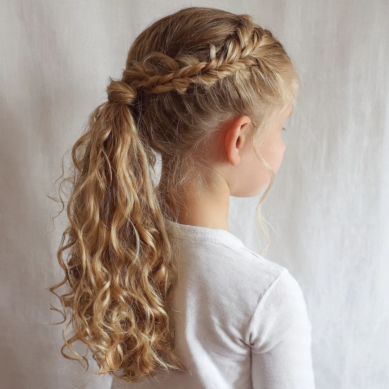 curly ponytail with braids for school