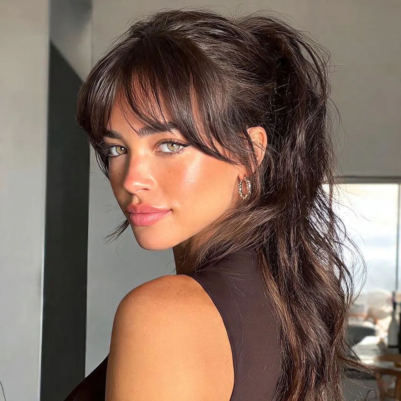 curtain bangs hairstyle with ponytail