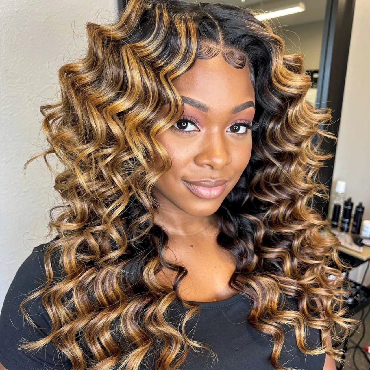 16 Trendy Curly Hair Color Ideas for Every Curl Type 14 single portrait of a woman with golden goddess hig