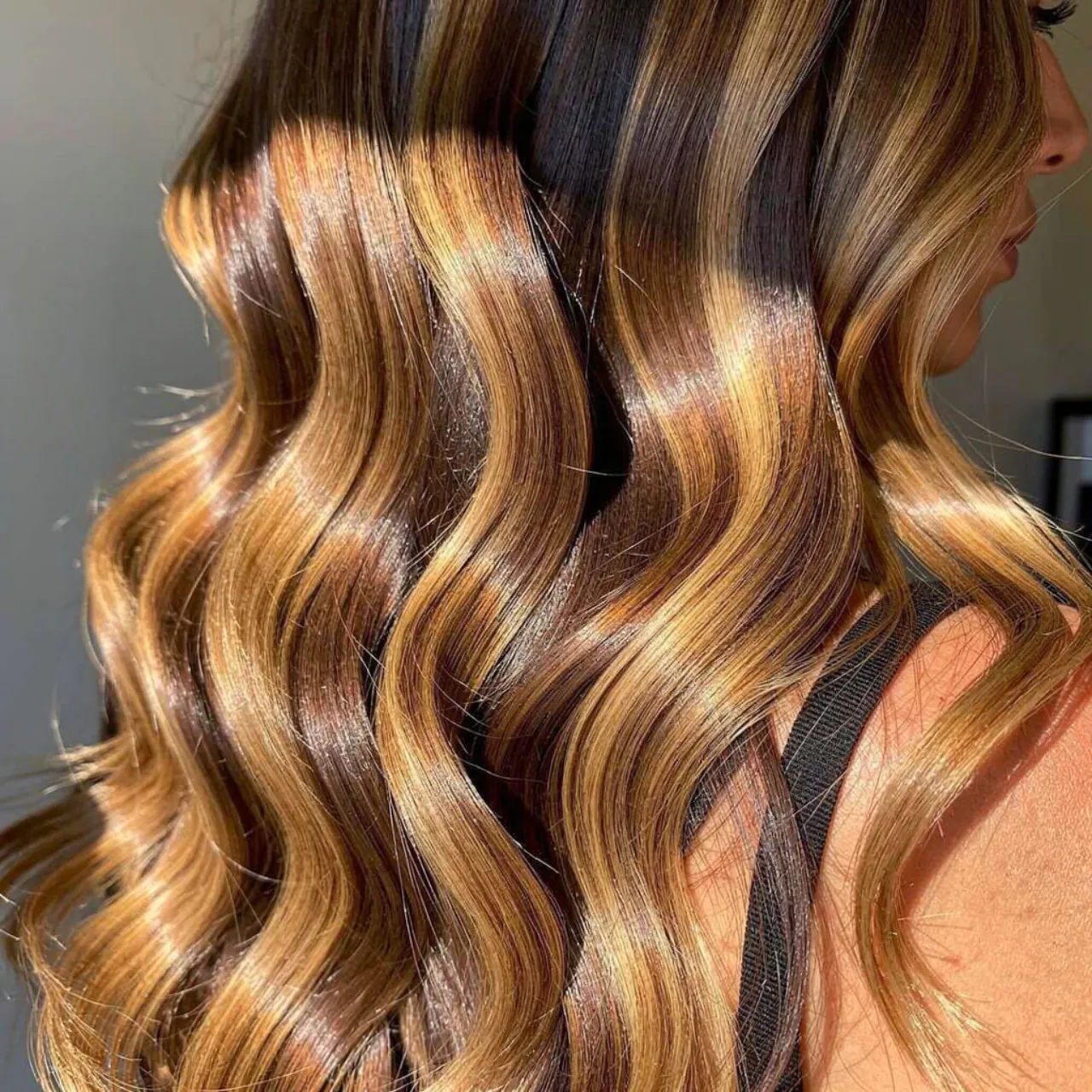 single square photo showcasing honey balayage hair