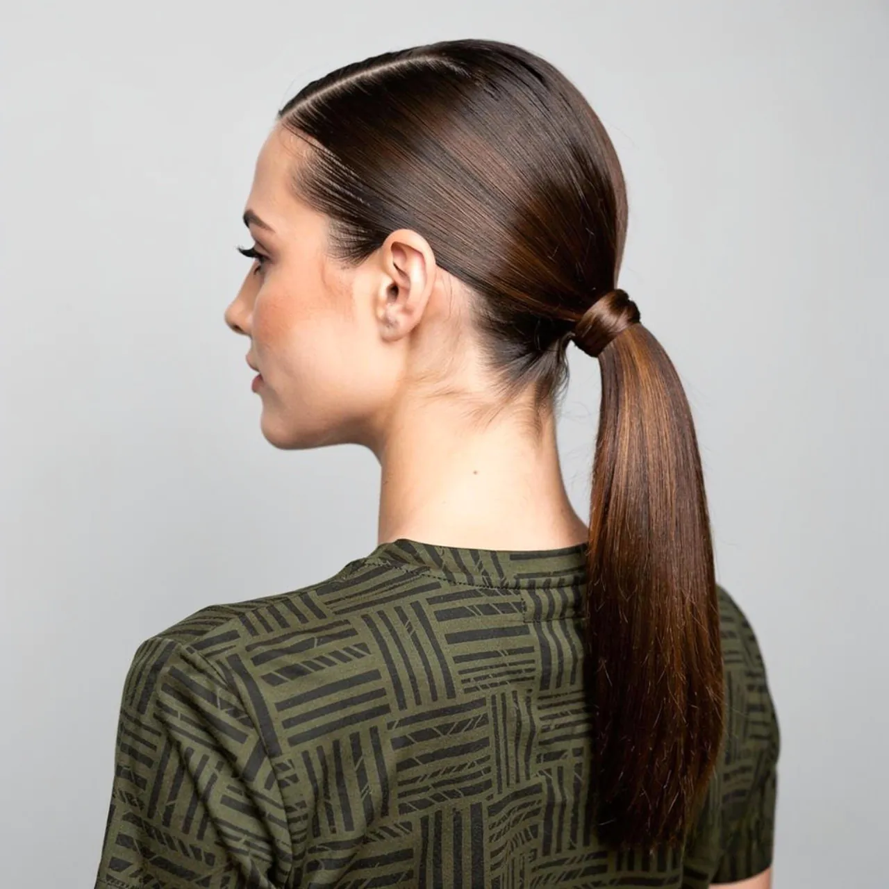 Fancy Ponytail Hairstyles: 15 Trendy Ideas that You’ll Love 9 square portrait of a woman with a sleek low fancy