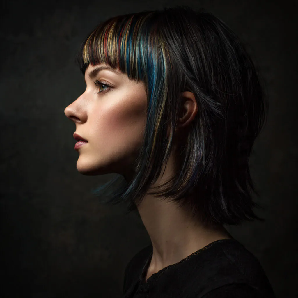16 Wolf Cut with Bangs: Trendy Styles & Ideas 14 wolf cut hairstyle with colored bangs single portr