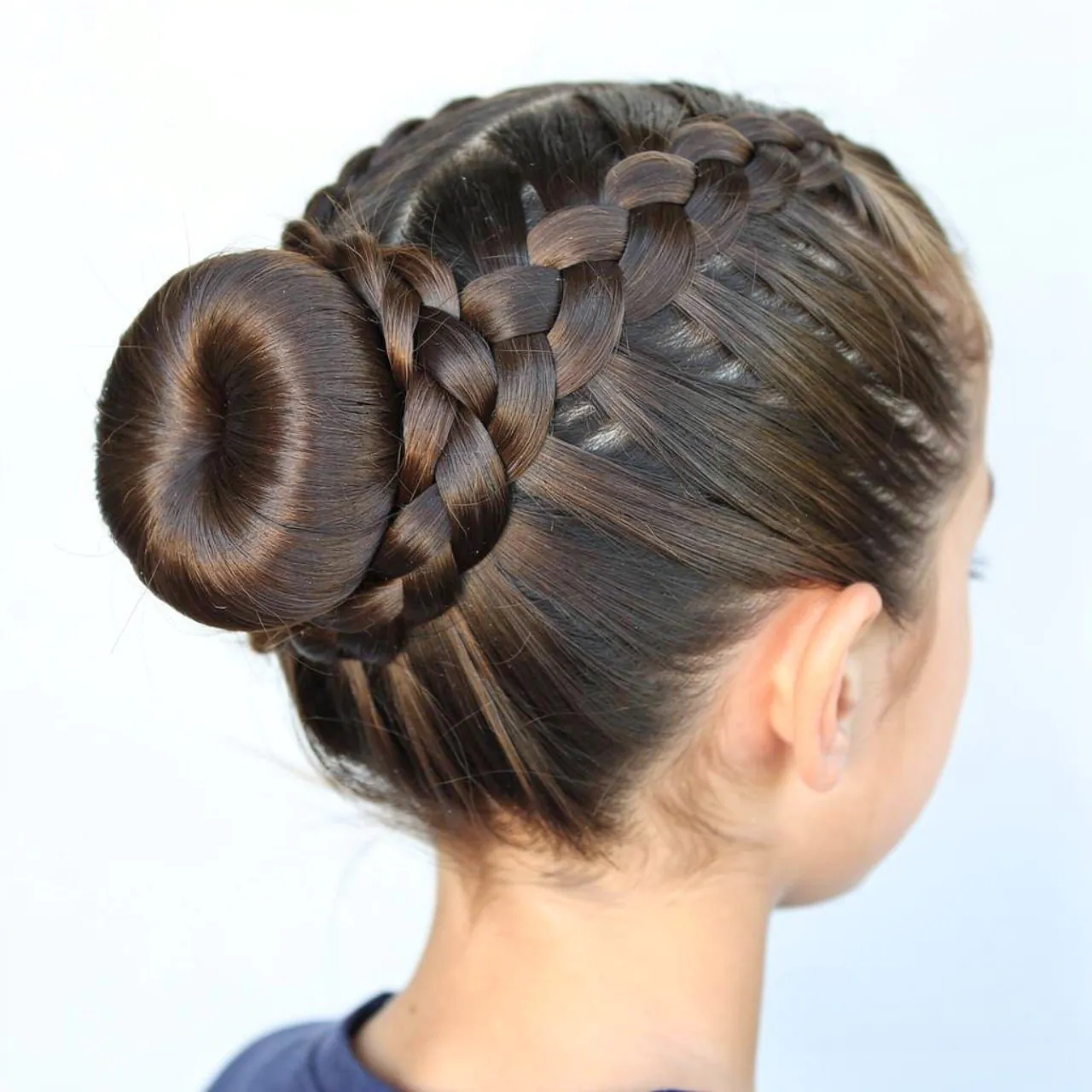 14 Trendy Hairstyles for School Braids That Stay Cute All Day 14 a single photo focused on a full braided bun hairs