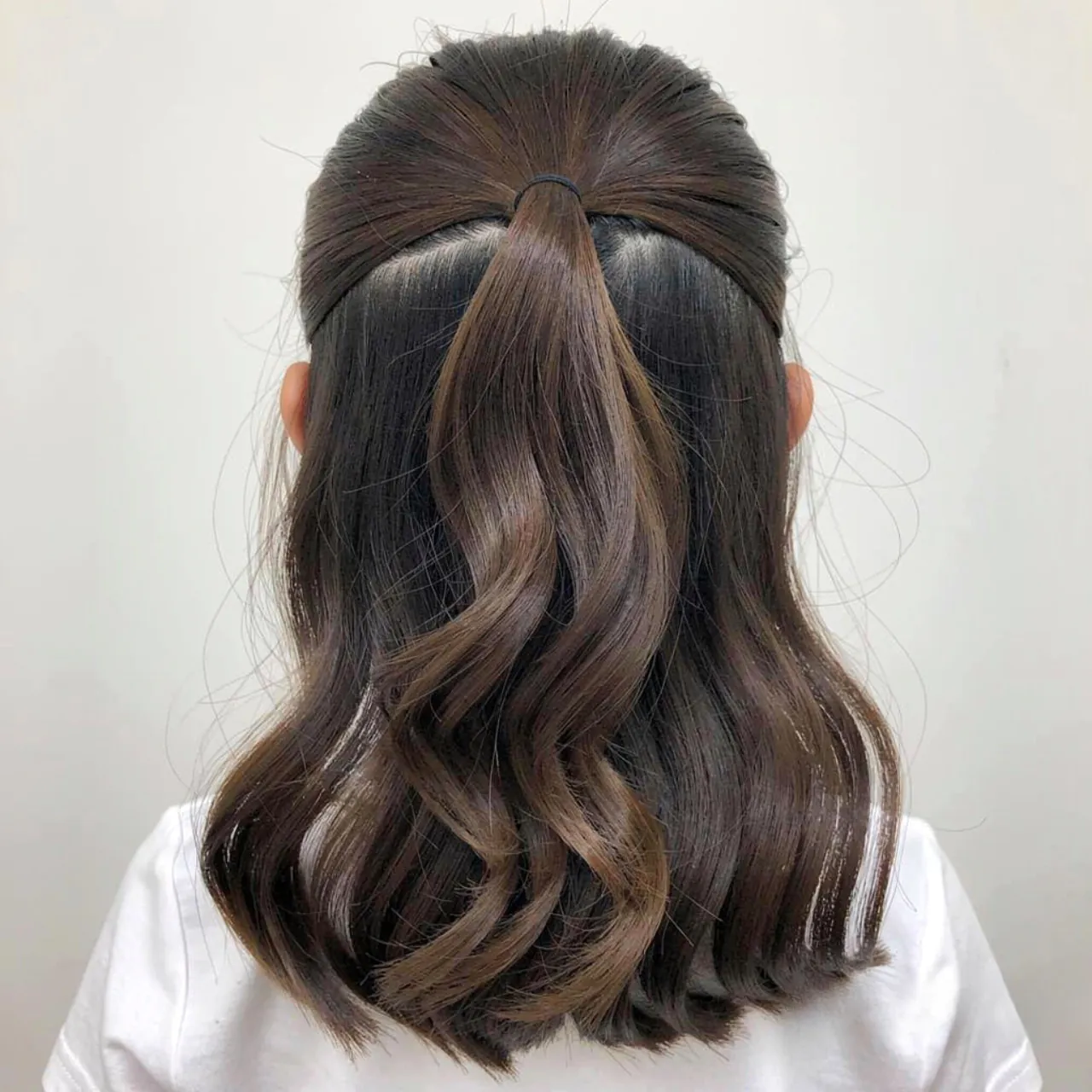 half up half down school hairstyle for medium leng