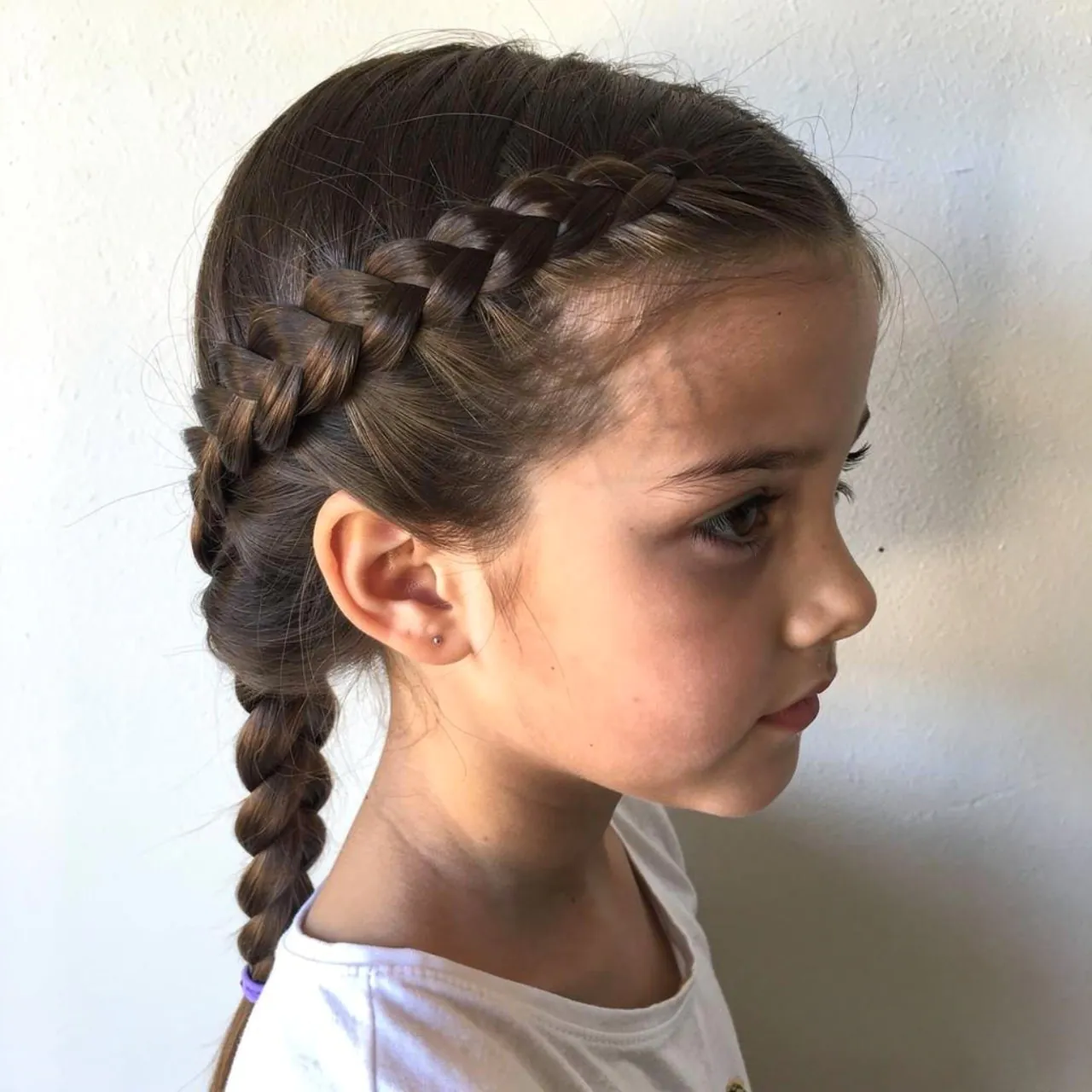 single photo of a side braid school hairstyle for