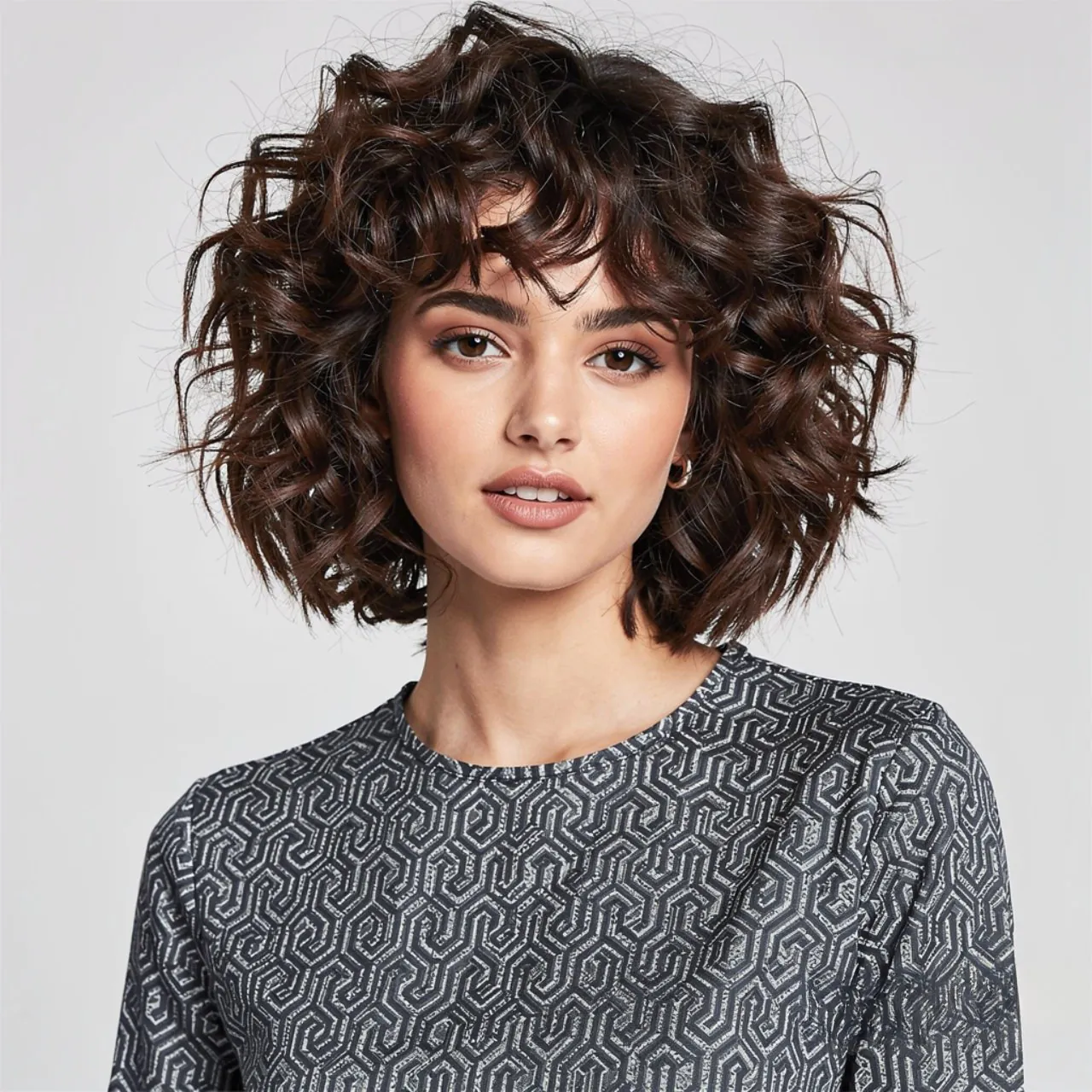 Curly Hairstyles for Short Hair: 13 Trendy Ideas that You’ll Love 4 square portrait of a woman with layered curly shor 1 1